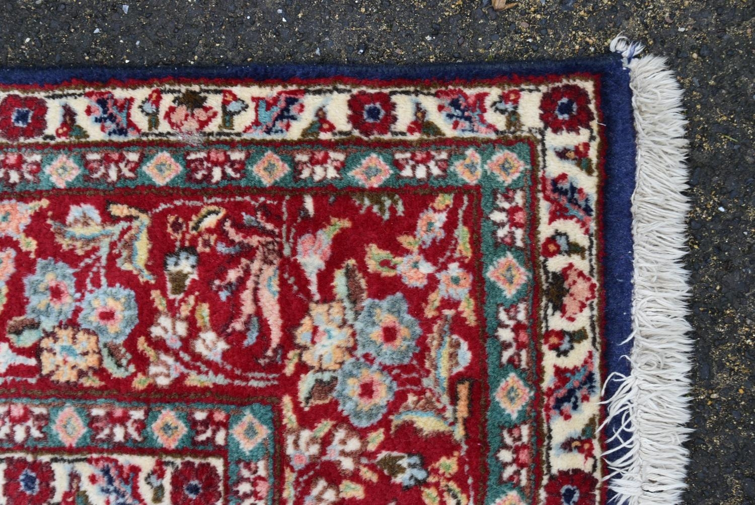 A Persian Keshan carpet with central floral medallion on sapphire ground within foliate multiple - Image 3 of 4