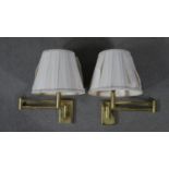 A pair of brass extending wall mounted lights with silk shades. H.37 W.60cm (extended)