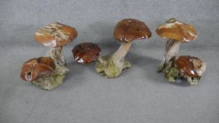 A collection of three pieces of scrap wood garden ornamentation carved as mushrooms. H.50 W.48 D.