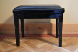 A contemporary lacquered ebonised adjustable piano stool. H.50 W.62 D.33cm