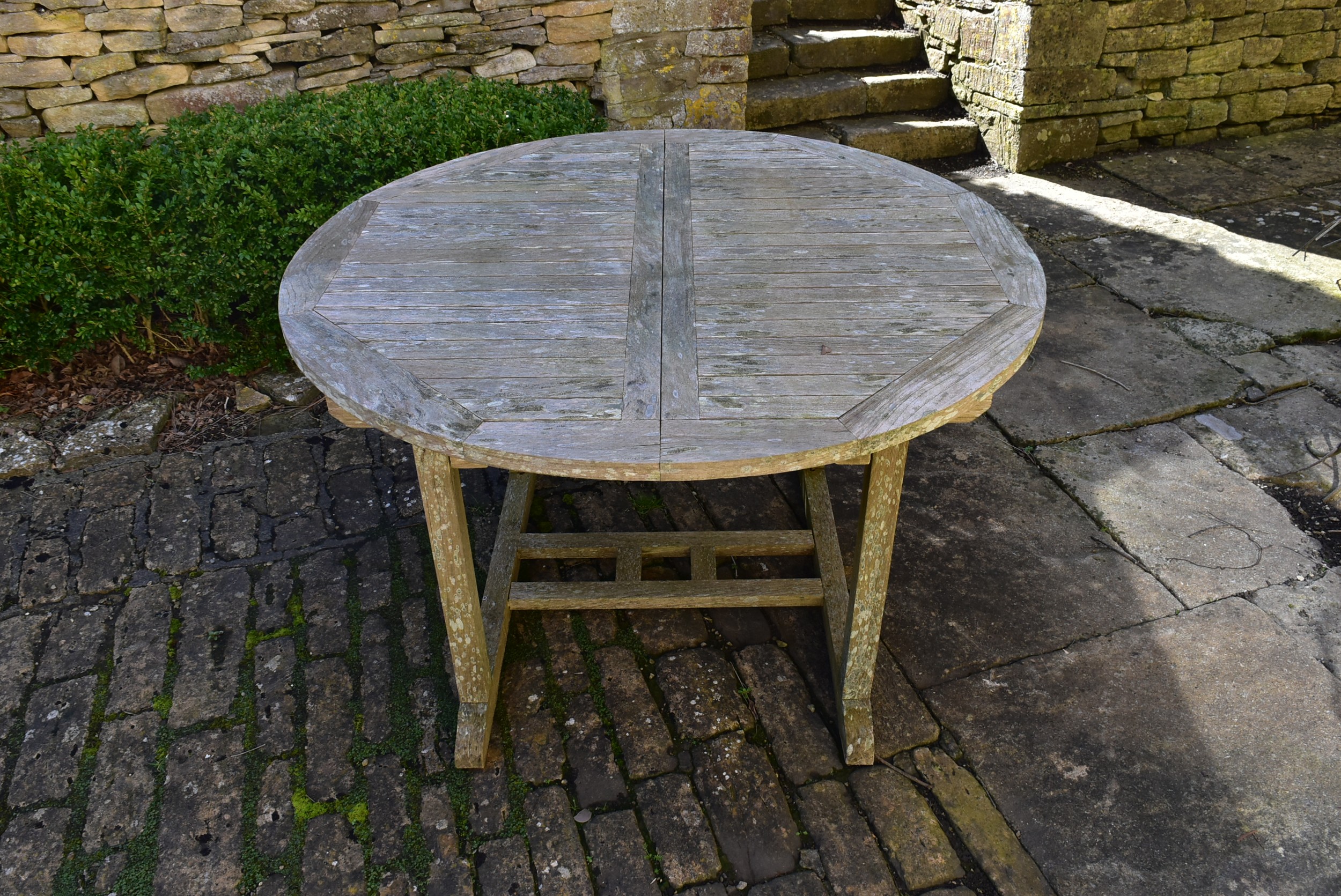 A weathered teak garden table with planked top on platform base. H.77 W.120 D.120cm - Image 2 of 6