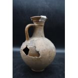 A single handed Roman clay pitcher dated AD 100. Accompanied by provenance. H.25cm