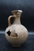 A single handed Roman clay pitcher dated AD 100. Accompanied by provenance. H.25cm