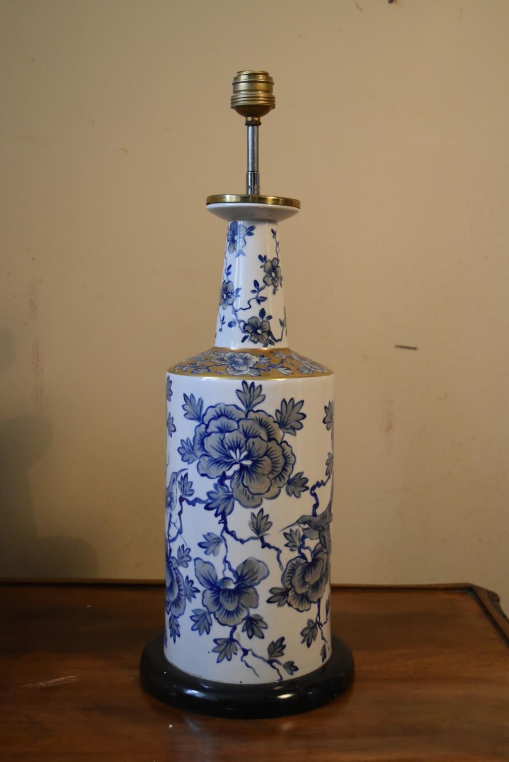 A contemporary blue and white table lamp, with floral decoration and a cream pleated shade. H.50 - Image 2 of 7