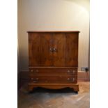 A Georgian style yew wood TV or HiFi cabinet. H.95 W.78 D.45cm