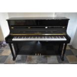 A 2012 Kawai upright piano, model K-2 in a lacquered ebonised case. H.114 W.147 D.56cm