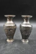 A pair of Chinese silver relief pine tree and figural design vases. Chinese makers mark to the base.