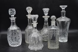 A collection of six cut glass and crystal decanters. Including, a Georgian mallet decanter, three