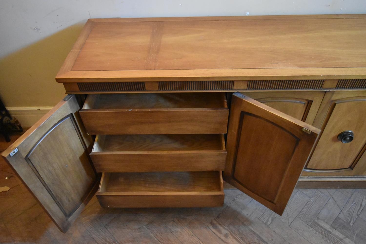 A walnut sideboard with panelled doors enclosing fitted interior on plinth base. H.76 W.170 D.48cm - Image 7 of 9
