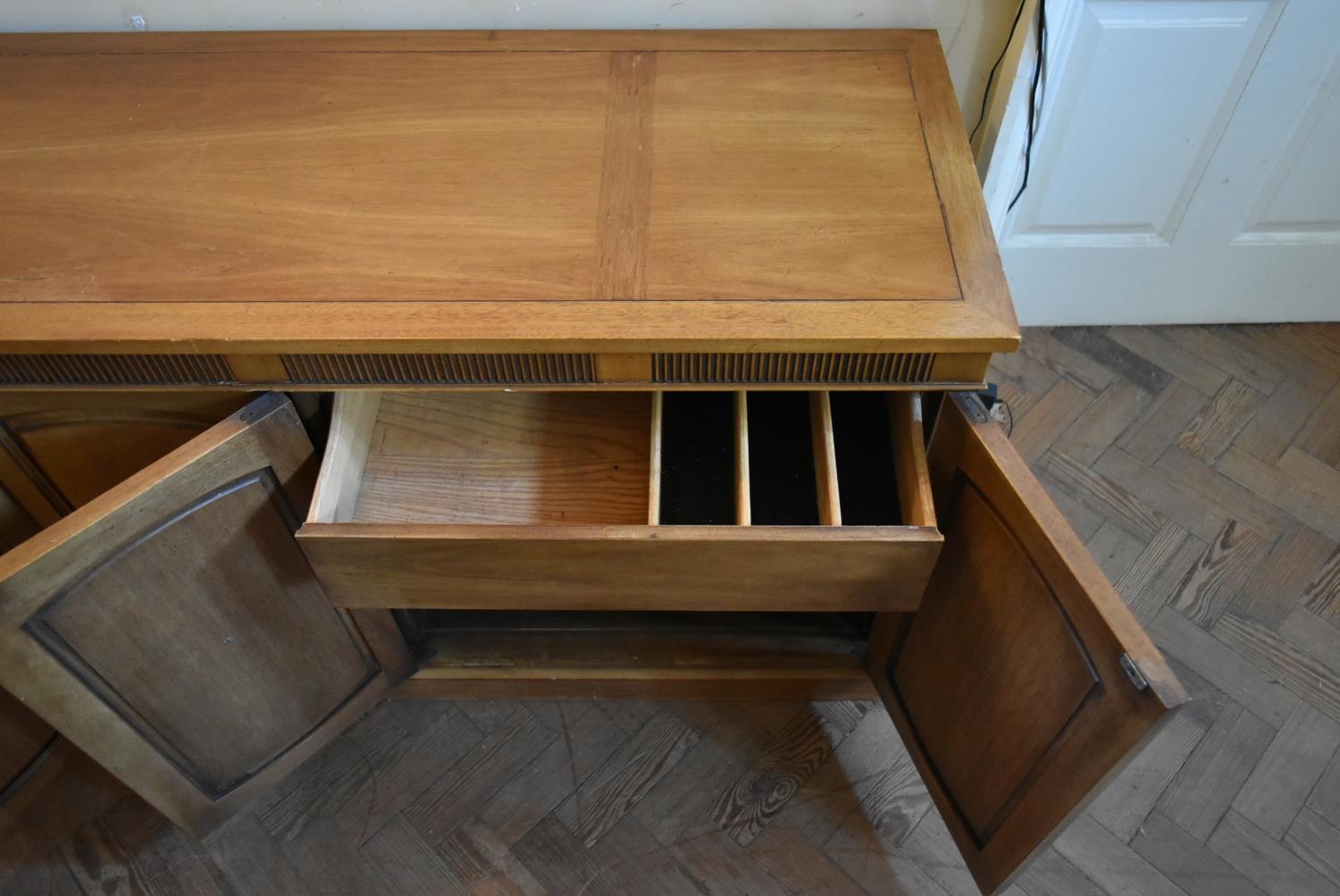 A walnut sideboard with panelled doors enclosing fitted interior on plinth base. H.76 W.170 D.48cm - Image 4 of 9