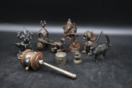 A collection of 19th century Chinese bronze figures. Including an Oriental dragon inlaid with coral
