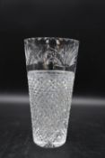 A large contemporary cut crystal glass vase of tapering form with foliate decoration. H.31 W.16cm