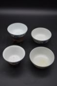 Four small Qing dynasty Chinese blue and white porcelain bowls, decorated with figures and flowers.