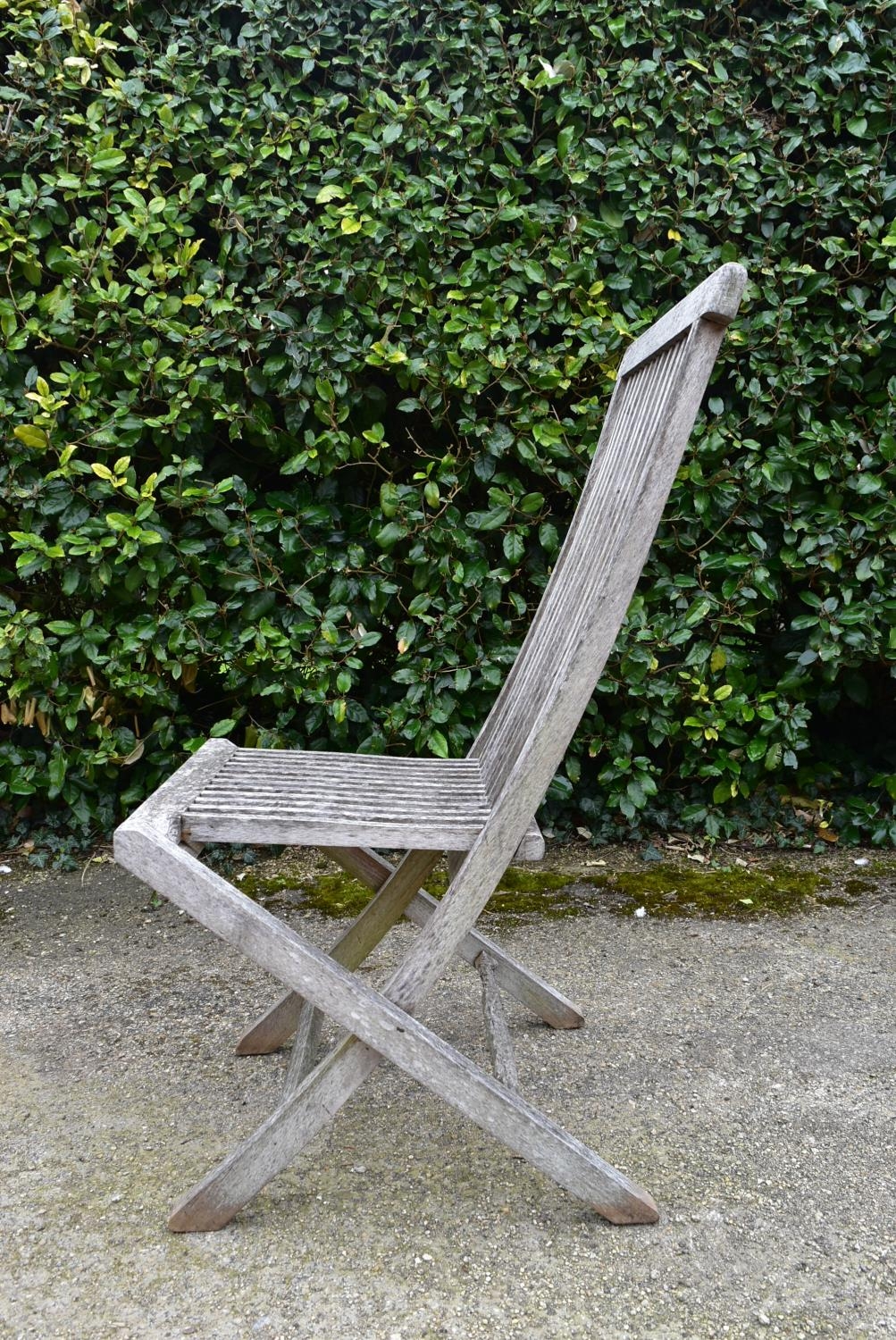 A set of five weathered teak folding and slatted garden chairs. H.99 W.46 D.43cm - Image 5 of 7
