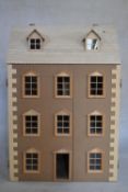 A contemporary Dartmouth three storey doll's house with six rooms. H.84 W.59 D.34cm