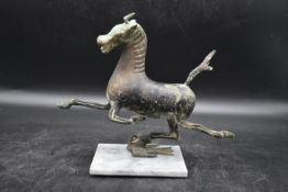 The Flying Horse of Gansu - Han dynasty (25-100ad) A Chinese bronze horse in flight treading on a