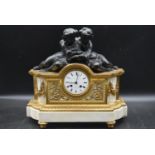 A 19th century French ormolu mantel clock, with a white enamal dial and Roman numerals, signed '