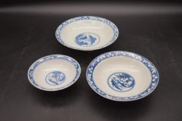 Three Ching dynasty blue and white footed porcelain bowls. Decorated with figures and temple scene