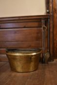A Victorian brass conserve pot along with fire irons. H.25 W.48cm (4)