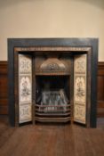 A late 19th century cast iron fire surround with ornate metalwork and foliate ceramic tile design.