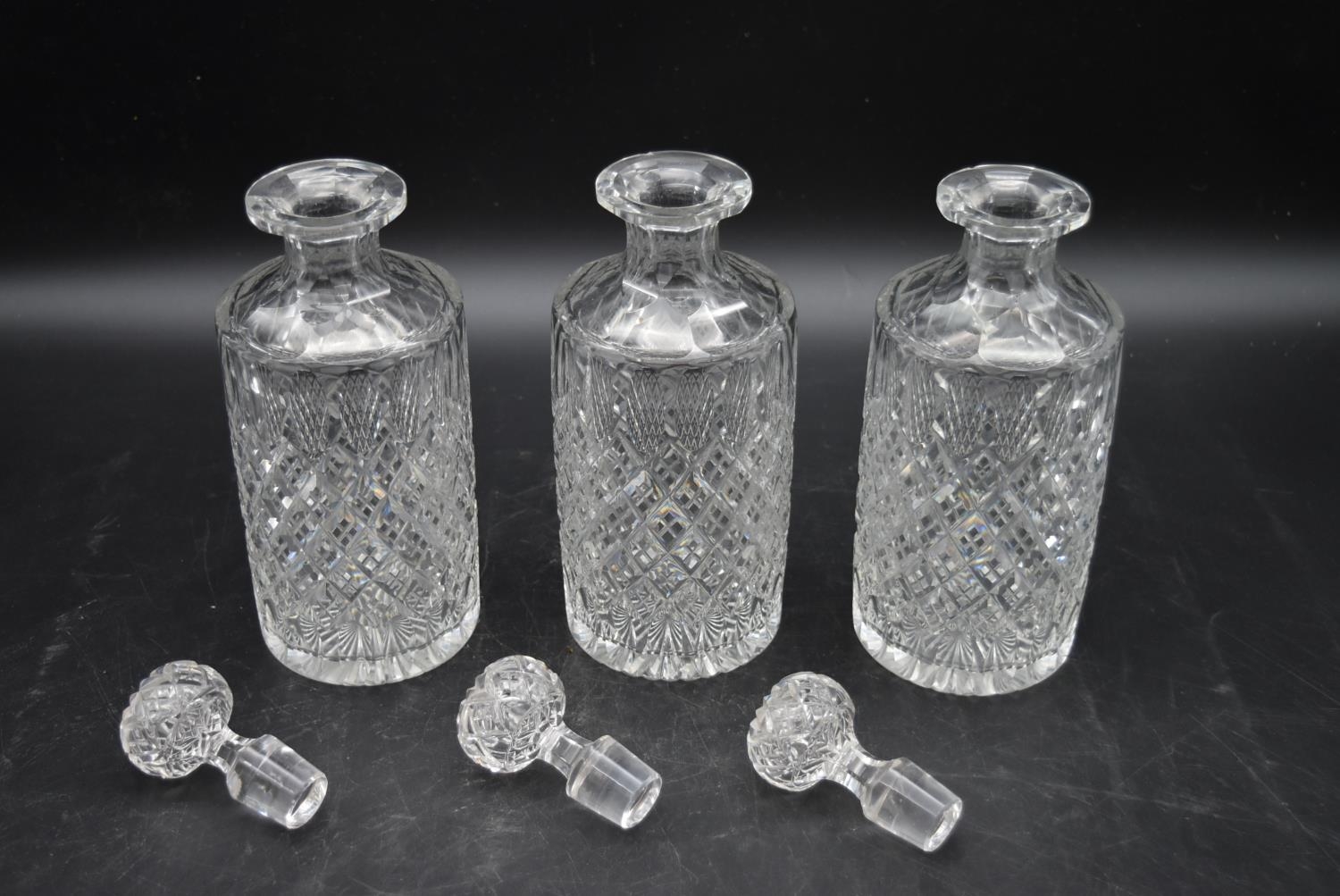 A set of three 20th century cut crystal glass topped decanters with a matching vase. H.27cm ( - Image 3 of 7