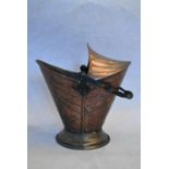 A late 19th century Arts and Crafts copper coal scuttle with a twisted wrought iron handle. H.45