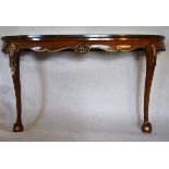 A mid century gilt highlighted walnut console table with green marble top on shell carved cabriole