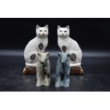 A pair of Takahashi Japan San Francisco Staffordshire cat bookend figures, along with a pair