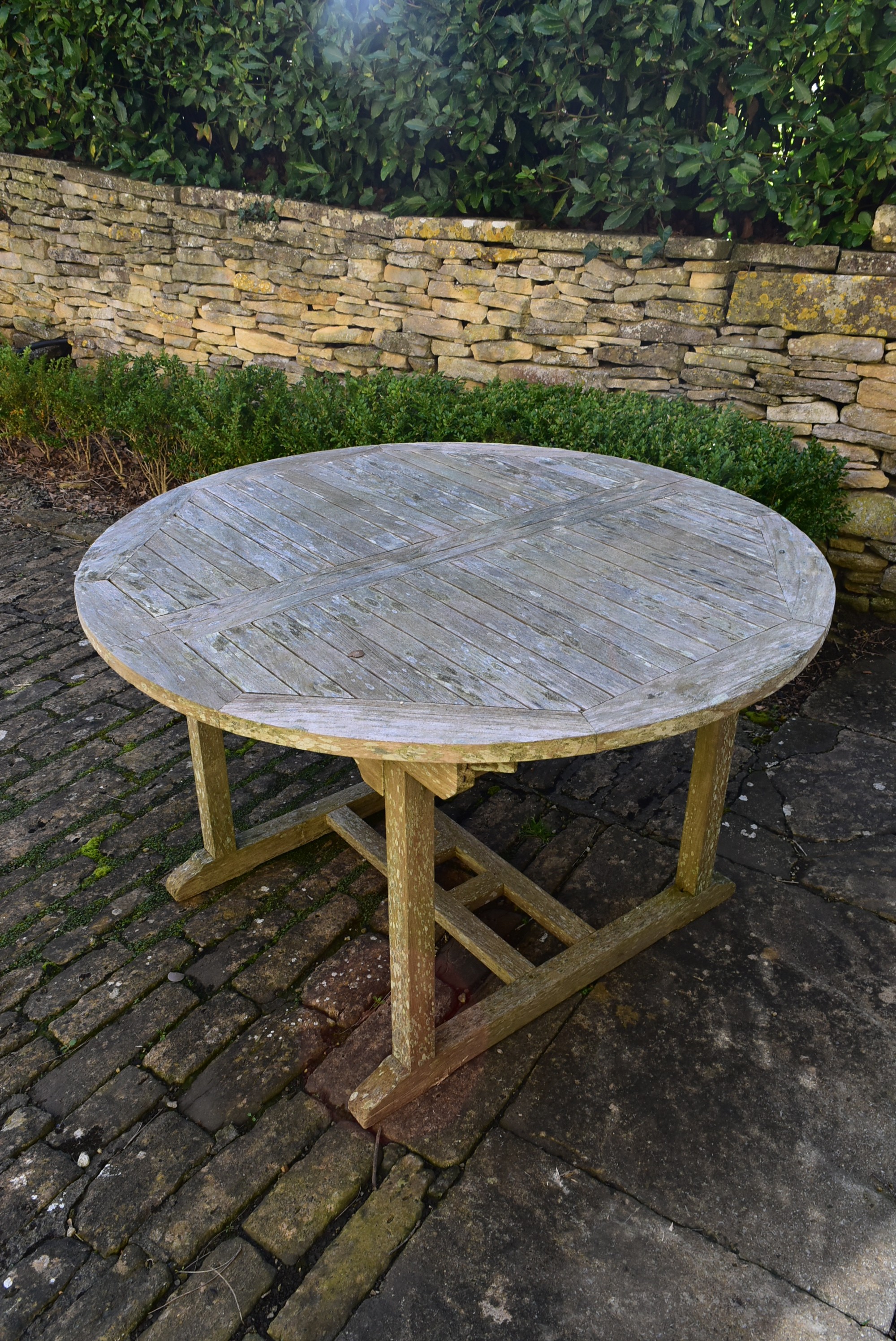 A weathered teak garden table with planked top on platform base. H.77 W.120 D.120cm - Image 4 of 6