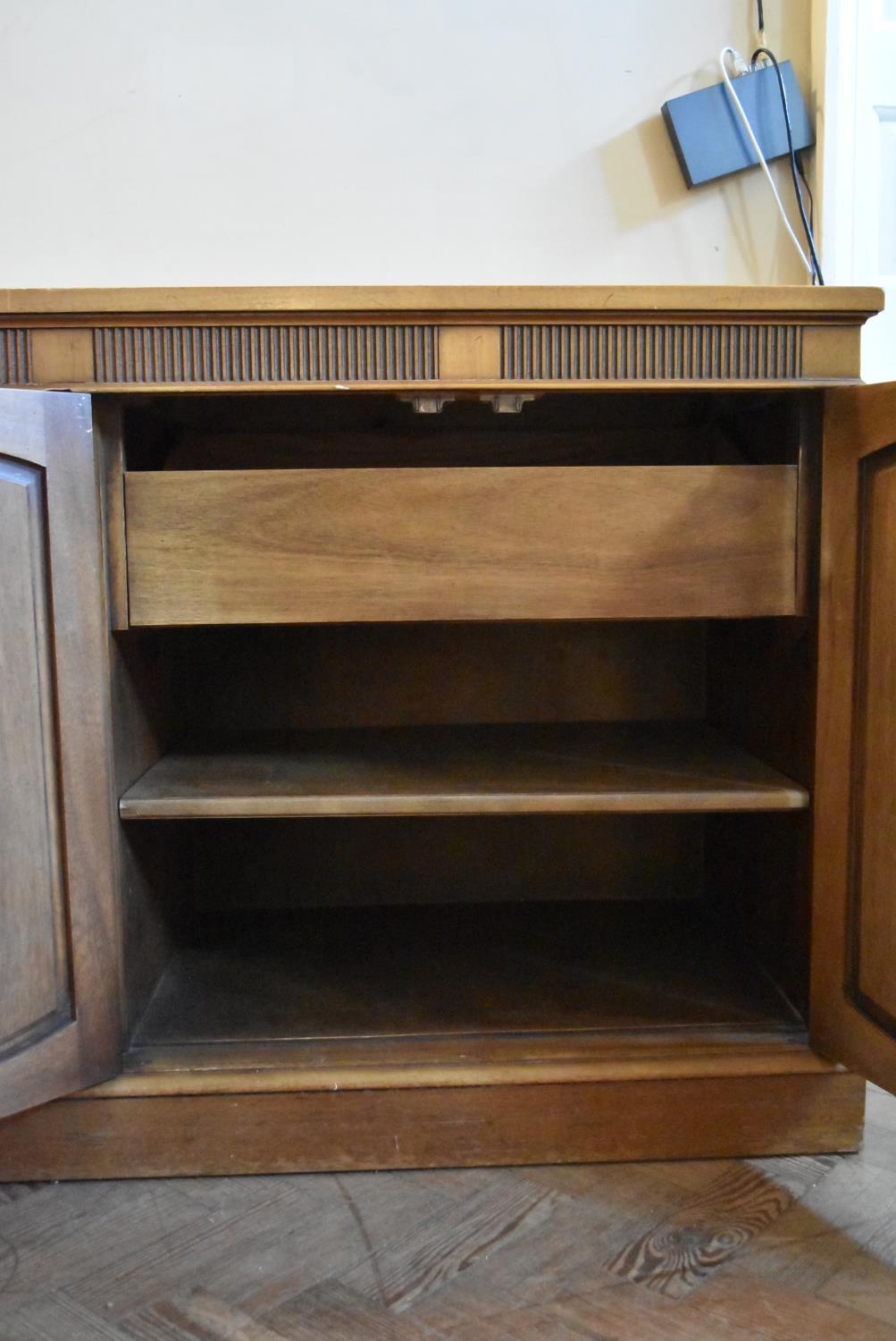 A walnut sideboard with panelled doors enclosing fitted interior on plinth base. H.76 W.170 D.48cm - Image 5 of 9