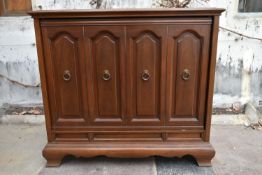 A walnut panelled cabinet fitted with vintage hi fi equipment. H.80 W.90 D.45cm