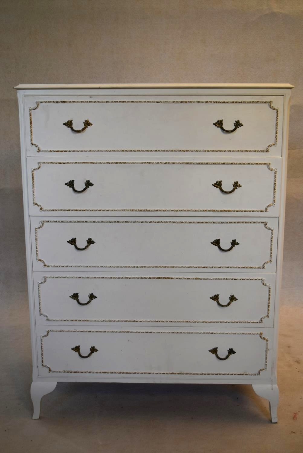 A mid century white painted chest of drawers. H.103 W.78 D.34cm