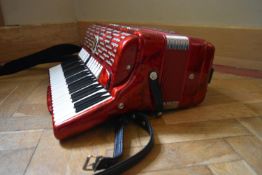 A Paolo Soprani Professionale Accordian with leather and velvet straps, original label and receipt