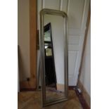 A contemporary full height easel dressing mirror in silvered arched moulded frame. H.171 W.55cm