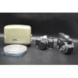 A collection of vintage film and photography equipment, to include a Praktica PLC3 camera,