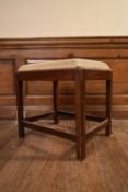 A 19th century mahogany piano stool with drop in tapestry seat on square stretchered supports. H.