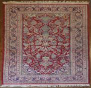 An Indian Jaipur rug on a red ground with a medallion motif. H.219 W.127cm