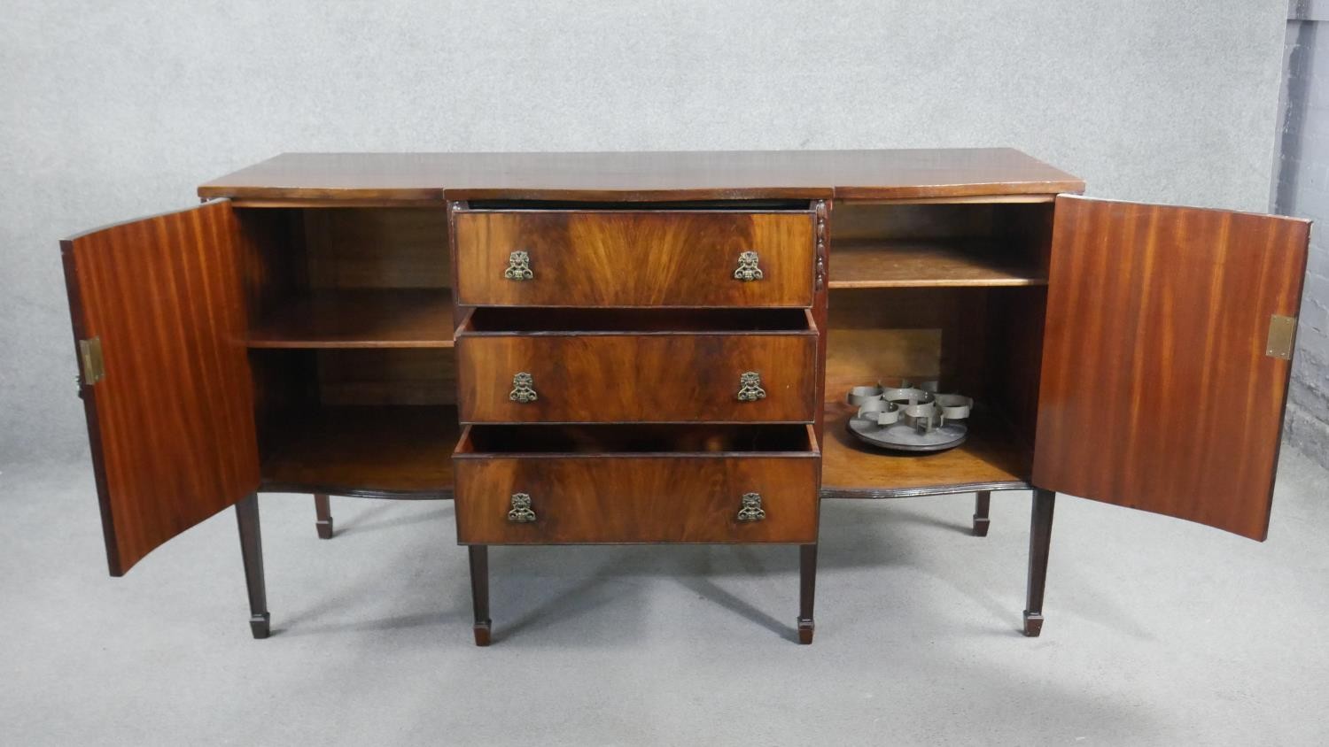 A Georgian style flame mahogany sideboard with husk carved decoration on square tapering supports. - Image 3 of 8