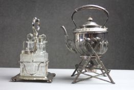 A Victorian silver plated floral design spirit kettle and branch design stand along with a cut glass
