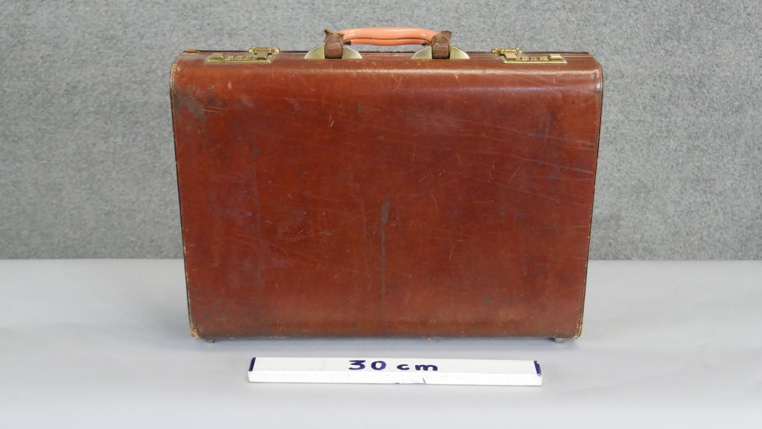 A vintage tan leather brief case with multi partitioned ostrich skin interior and brass hardware. - Image 6 of 6