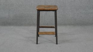 A vintage teak and metal framed laboratory stool. H.56 W.32 D.32cm