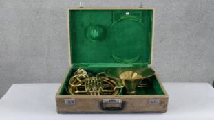 A vintage 'Parrot' brass french horn with case. Engraved makers stamp and mouth piece stamped