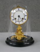A 19th century French gilt metal ormolu foliate and floral design mantle clock with glass and
