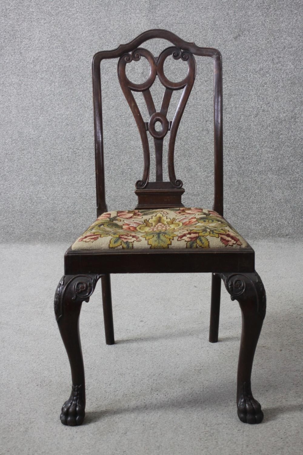 A mid Georgian style mahogany armchair on carved cabriole supports.
