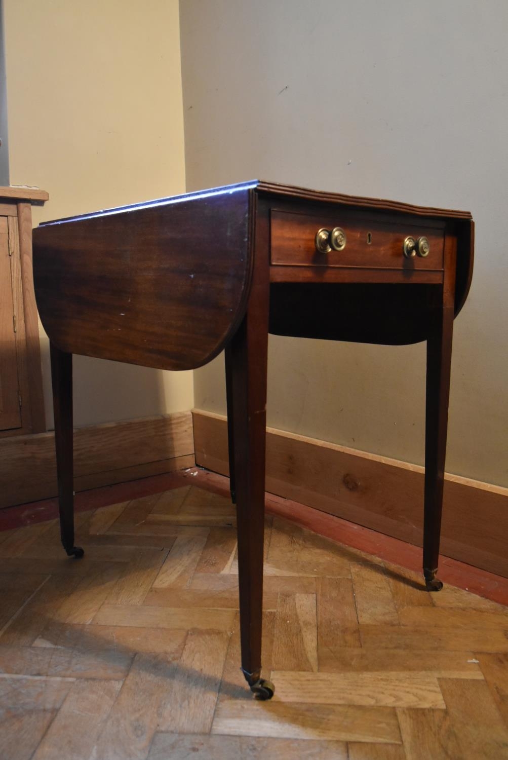 An early 19th century mahogany drop flap Pembroke table on square tapering supports terminating in - Image 3 of 7