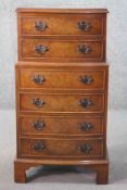 A mid century early Georgian style burr walnut chest on bracket feet. H.85 W.43.D.32 cm.