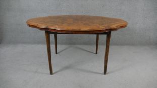 A mid 19th century quarter veneered burr walnut dining table on later supports. H.76 W.150 D.110cm