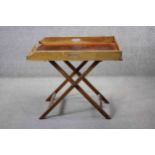 A 19th century mahogany butler's tray on folding stand. H.80 W.86 D.61 cm