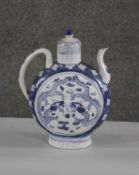 A large Chinese Qianlong style blue and white lidded ewer, decorated with dragons. Character mark to