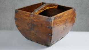 A Qing dynasty hardwood rice measure with engraved Chinese characters to each side. H.26 W.34 D.32cm